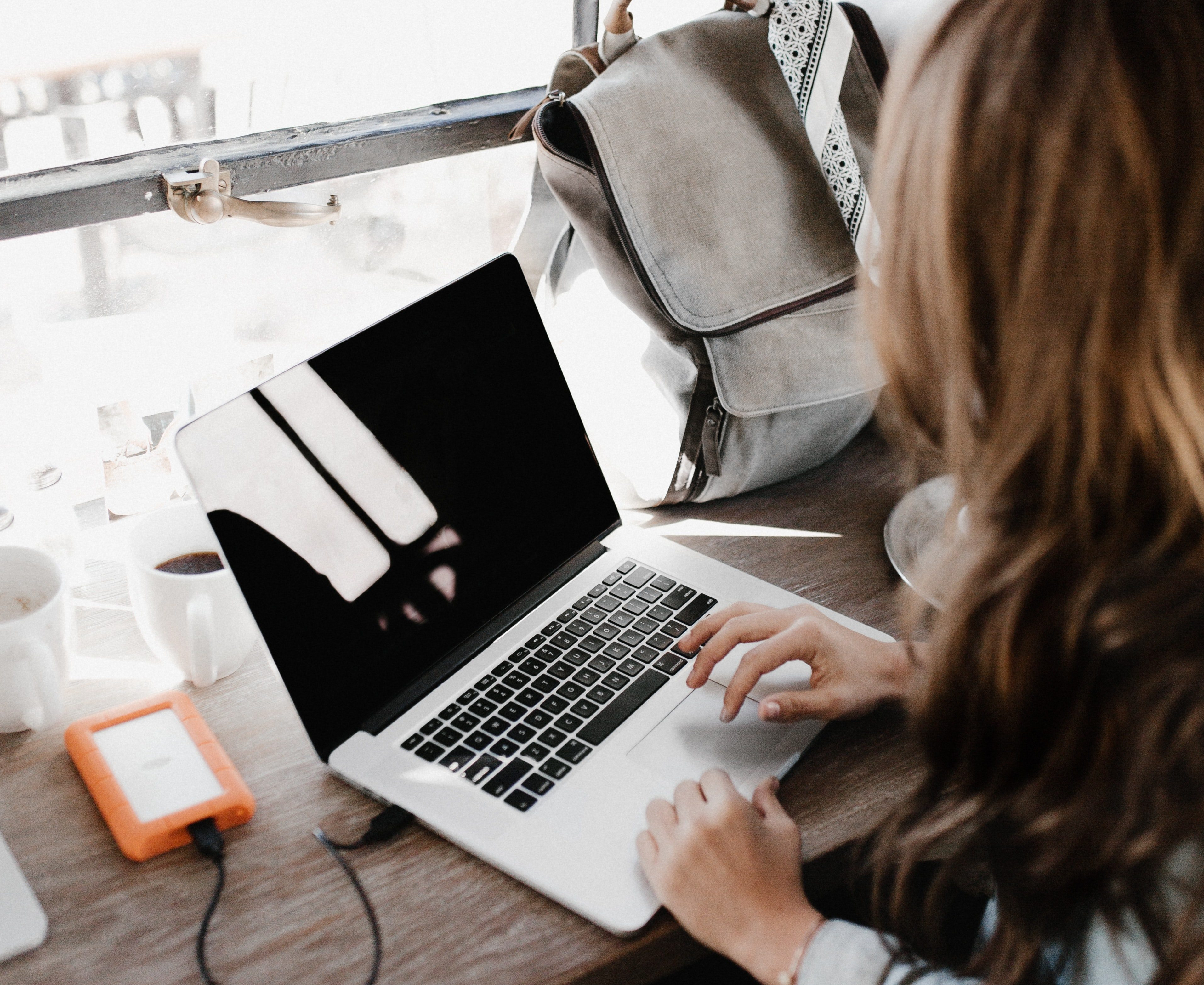 close-up-photography-of-woman-sitting-beside-table-while-3178818